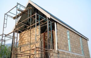 peninggian dinding rumah